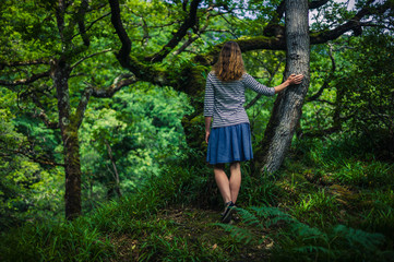 Young woman walking in the woods