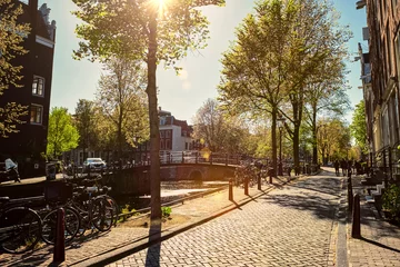 Fotobehang Amsterdam street with canal © Dmitry Rukhlenko