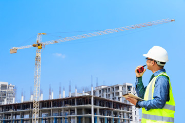 Engineer supervising building construction.