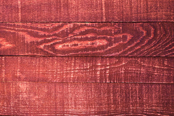 Wooden background from boards of a red color.