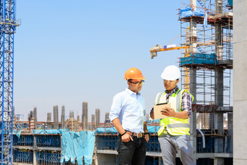 Engineer supervising building construction.