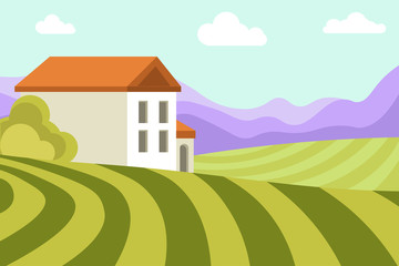 Neat small house among wide green fields and high mountains