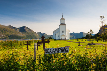 White church and small cemetery in Bardstrand,Norway