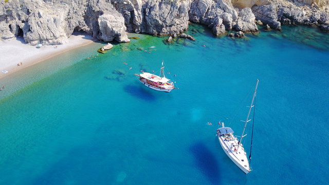 August 2017: Aerial drone photo of paradise beach of Traganou with small caves and turquoise clear waters, Rhodes island, Dodecanese, Aegean, Greece
