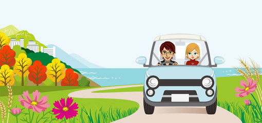 Car driving in the Autumn road ,Front view - Young couple