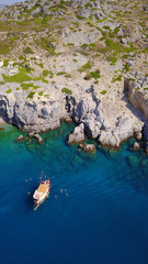 August 2017: Aerial drone photo of paradise beach of Traganou with small caves and turquoise clear waters, Rhodes island, Dodecanese, Aegean, Greece