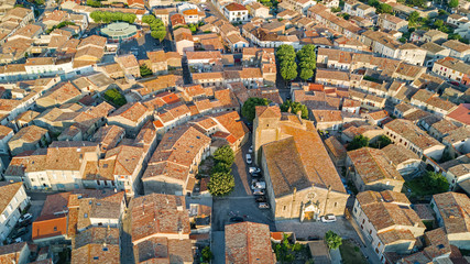 Aerial top view of Bram medieval village architecture and roofs from above, Southern France
