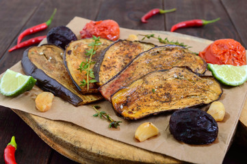 Baked eggplant with herbs and spices. Vegetarian cuisine.
