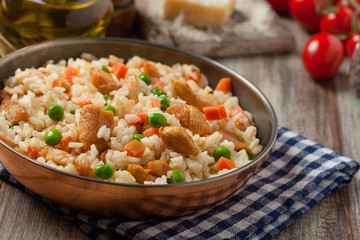 Delicious risotto with chicken and green peas.