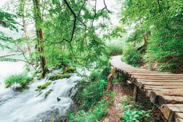 Plitvice Lakes National Park, tourist route on the wooden flooring along the waterfall