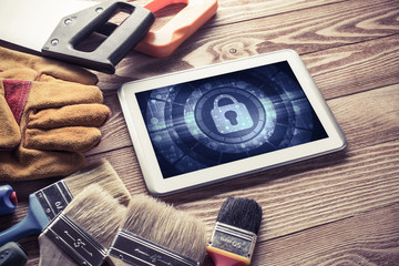 Web security and technology concept with tablet pc on wooden tab © adam121