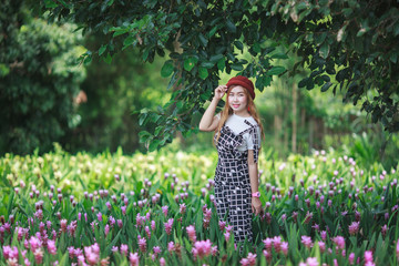 Beautiful girl holding bouquet flowers .Portrait in nature field