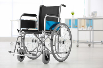 Fototapeta na wymiar Wheelchair in light room. Elderly care concept