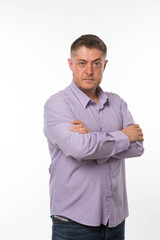 Young confident man portrait of a confident businessman showing by hands on a gray background. Ideal for banners, registration forms, presentation, landings, presenting concept.