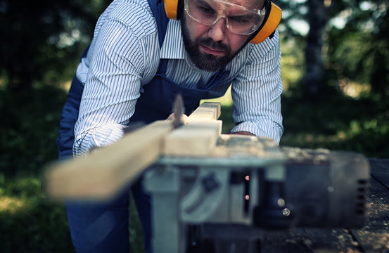 Worker Beard Man With Circular Saw