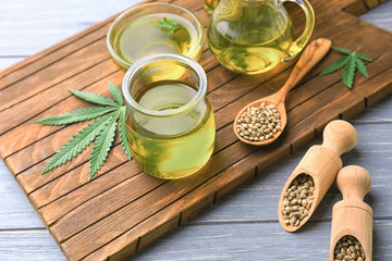 Composition with hemp oil on wooden table