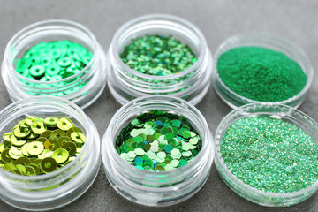 Green sequins and sparkles on table
