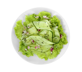 Fresh vegetable salad with cucumbers on plate, isolated on white