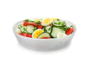 Healthy salad with cucumbers and eggs in bowl, isolated on white