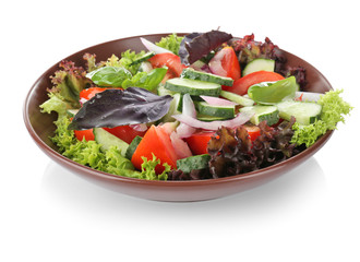 Fresh vegetable salad with cucumbers in bowl, isolated on white