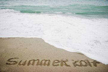 Summer 2017 end. New Year 2018 is coming concept. Sea and sand.