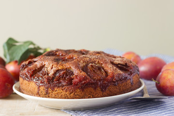 Plum pie or cake with cinnamon and sugar. Selective focus.