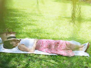 women sleeping in garden