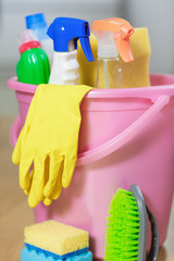 Plastic bucket with cleaning product at home