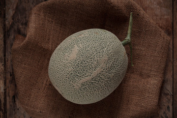 Melon on wooden floor.