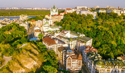 Aerial top view of Saint Andrew's church and Andreevska street from above, cityscape of Podol...