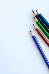 Set of colorful pencils on a white background. Close up and copy space.