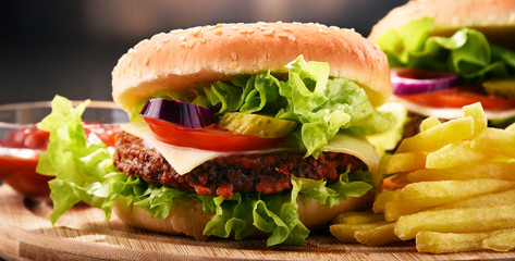 Homemade hamburger with cheese and fresh vegetables