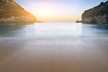 Long exposure landscape sand beach in close bay at dusk,