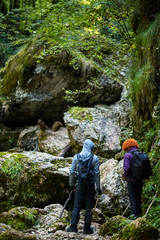 Hikers with backpacks in a canyon