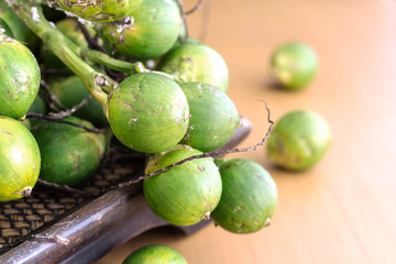 betel nut on wooden tray.