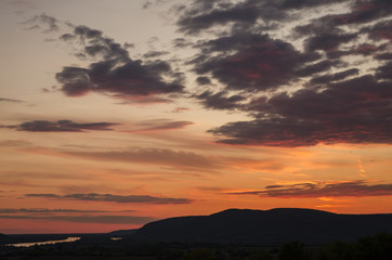 end of summer cloudy sunset in september, sunset in Hungary by Danube