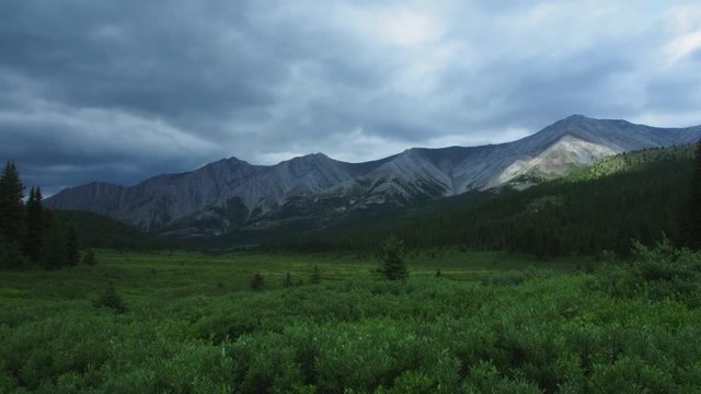 Timelapse of rolling clouds and rain in the wilderness of Banff National Park
