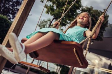 Little girl on swing