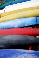 Fotobehang various colorful canoes © diecidodici