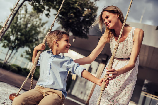 Mom with son on swing