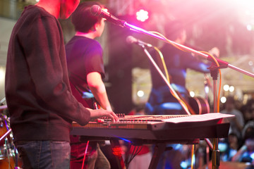 Keyboardist on stage for background, soft and blur concept