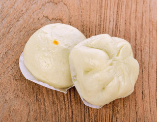 Steamed stuffed buns on wooden background