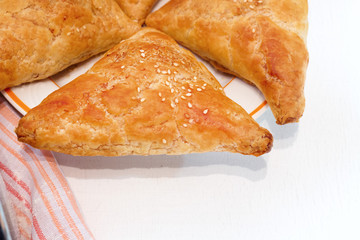 Hamantaschen cookies for Jewish festival of Purim on wooden table