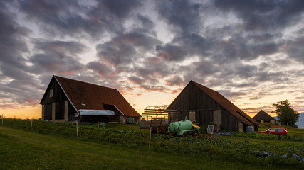 Fototapeta na wymiar Traditional barns on the edge of a village in northern Slovakia. 