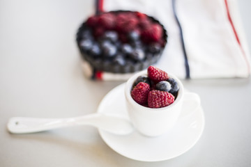 Healthy mixed fruit and ingredients with strawberry, raspberry, blueberry, blackberry from top view