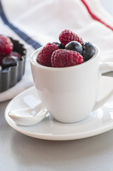 Healthy mixed fruit and ingredients with strawberry, raspberry, blueberry, blackberry from top view