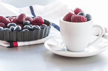 Healthy mixed fruit and ingredients with strawberry, raspberry, blueberry, blackberry from top view