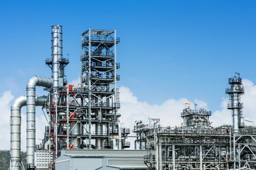 Refinery tower in petrochemical industrial plant with blue sky