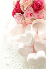 heart shaped marshmallow and artificial flower