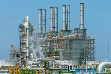 Refinery tower in petrochemical industrial plant with blue sky